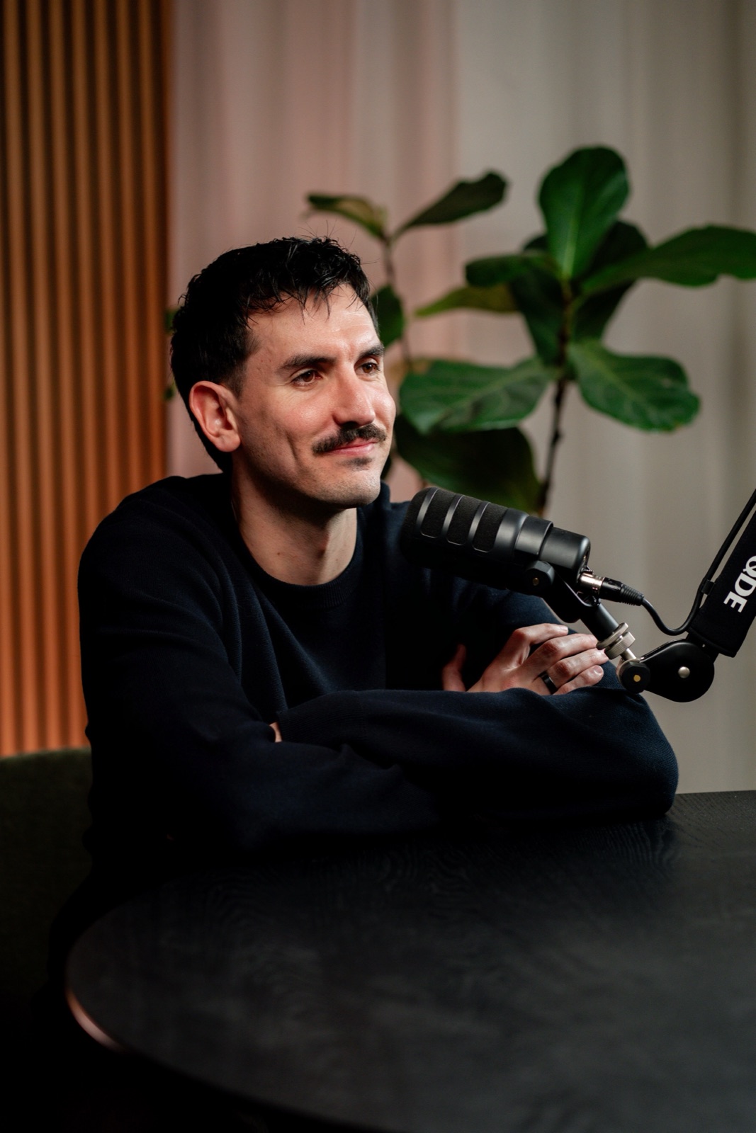 Bailey Clift at the microphone, mid-conversation