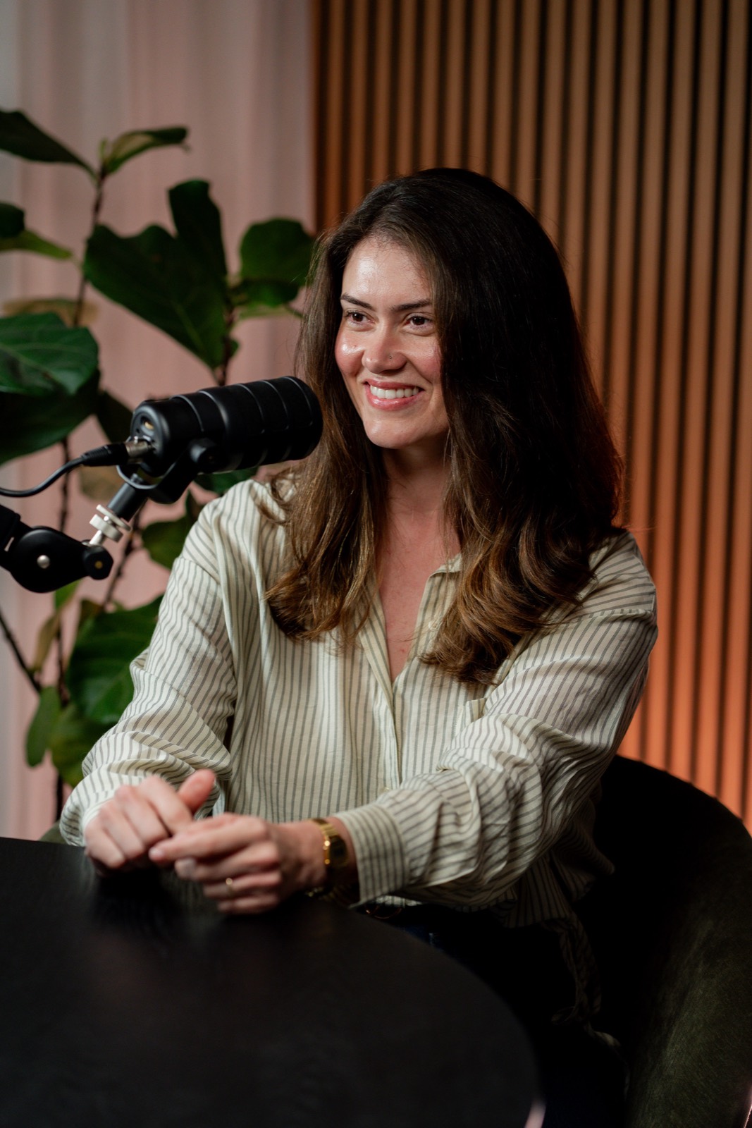 Robyn Cornish-Hall at the microphone, mid-conversation